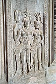 Angkor Wat temple, second enclosure, devatas sculpted in bas-relief with an extraordinary variety of intricate hair styles and costumes.